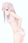  1girl adjusting_clothes adjusting_panties ass back blue_eyes bra breasts cowboy_shot crotch_seam from_side grey_hair highres inatsu_yui leaning_forward long_hair looking_at_viewer looking_back original panties parted_lips pink_bra pink_panties simple_background small_breasts standing underwear underwear_only white_background 