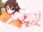  animal_ears bad_id bad_pixiv_id barefoot black_hair blush bow bunny_background bunny_ears bunny_tail carrot carrot_pillow dress hair_bow inaba_tewi looking_at_viewer pillow pillow_hug pink_background pink_dress puffy_short_sleeves puffy_sleeves red_eyes short_hair short_sleeves smile solo sugimon tail touhou 