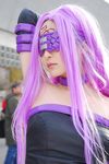  arm_up blindfold choker cosplay dress elbow_gloves fate/stay_night fate_(series) gloves long_hair non-web_source photo purple_hair rider rider_(cosplay) solo strapless strapless_dress 
