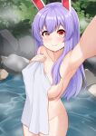  1girl akasaka_sato animal_ears areola_slip armpits blush breasts closed_mouth collarbone cowboy_shot highres holding holding_towel large_breasts long_hair looking_at_viewer naked_towel nude onsen purple_hair rabbit_ears rabbit_girl red_eyes reisen_udongein_inaba smile solo touhou towel water wet 