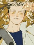  1boy arm_up black_hair blue_shirt bokuto_koutarou chengongzi123 cherry_blossoms collared_jacket colored_eyelashes english_commentary flower grey_hair grin haikyuu!! high_collar highres holding holding_flower jacket looking_at_viewer male_focus multicolored_hair shirt short_hair simple_background slit_pupils smile streaked_hair thick_eyebrows uneven_eyes upper_body very_short_hair yellow_background yellow_eyes 