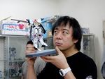  1boy action_figure animator anime_designer asian celebrity director dragonar figure garage_kit guy lowres male male_focus masami_obari mecha oobari_masami otaku photo real sculpture solo watch 