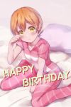  1girl :&lt; bangs bed between_legs blush buttons closed_mouth collarbone commentary_request english_text eyebrows_visible_through_hair hair_between_eyes hand_up happy_birthday head_tilt highres hitotsuki_no_yagi hoshizora_rin looking_at_viewer love_live! love_live!_school_idol_project orange_hair pajamas pillow pink_pajamas pink_pillow rubbing_eyes short_hair short_sleeves sidelocks sitting solo striped striped_pajamas wariza yellow_eyes 