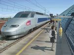  2girls backpack bag copyright_request evokid france ground_vehicle multiple_boys multiple_girls real_world_location realistic scenery sncf tgv train train_station watermark waving 