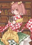  1girl absurdres apron bell blush book bookshelf checkered_clothes checkered_kimono closed_mouth commentary_request commission cowboy_shot crossed_arms floating_clothes frilled_apron frills from_side green_skirt hair_bell hair_ornament highres holding holding_book indoors japanese_clothes jingle_bell kimono long_sleeves looking_at_viewer medium_hair motoori_kosuzu pink_hair red_eyes saimu_taju skeb_commission skirt smile solo split_mouth touhou two_side_up wide_sleeves yellow_apron 