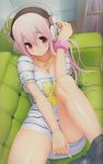  1girl around back blush bookshelf bracelet breasts cleavage couch covering crotch eyes hair headphones jewelry leg long lying necklace nitroplus pants pants_pull pink santa santa_costume shirt_pull solo source_request super_sonico tsuji_santa 