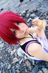  barefoot blue_eyes cosplay jewelry kairi_(kingdom_hearts) kingdom_hearts lowres necklace non-web_source photo red_hair short_hair sitting solo 
