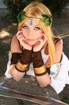  1girl blonde_hair cosplay long_hair looking_at_viewer photo solo sophitia_alexandra sophitia_alexandra_(cosplay) soul_calibur soulcalibur_iii 