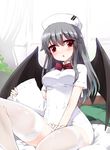  bat_wings black_hair blush character_request covered_navel hat kt2 long_hair nurse_cap pillow red_eyes short_sleeves solo thighhighs white_legwear wings zettai_ryouiki 