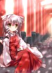  absurdres animal_ears detached_sleeves fox_ears fuuna hakama highres japanese_clothes long_hair miko multiple_torii original red_hakama ribbon-trimmed_sleeves ribbon_trim silver_hair sitting solo torii yellow_eyes 