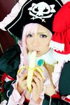  1girl banana breasts captain_liliana captain_liliana_(cosplay) chouzuki_maryou cosplay food fruit hat highres large_breasts lost_worlds photo pink_hair pirate pirate_hat plump purple_eyes queen&#039;s_blade queen's_blade queen's_blade_rebellion sexually_suggestive 