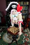  1girl board_game breasts captain_liliana captain_liliana_(cosplay) chess chouzuki_maryou cosplay hat highres large_breasts photo pink_hair pirate pirate_hat plump purple_eyes queen&#039;s_blade queen's_blade queen's_blade_rebellion 