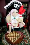  1girl board_game breasts captain_liliana captain_liliana_(cosplay) chess chouzuki_maryou cosplay hat highres large_breasts photo pink_hair pirate pirate_hat plump purple_eyes queen&#039;s_blade queen's_blade queen's_blade_rebellion 