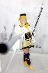  1girl asian blonde_hair breasts brown_eyes chouzuki_maryou cosplay drill_hair fingerless_gloves gloves gun hat large_breasts magical_musket mahou_shoujo_madoka_magica musket photo plump solo tomoe_mami tomoe_mami_(cosplay) twin_drills weapon 