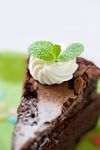  cake chocolate_cake depth_of_field food kya4 mint no_humans original photorealistic slice_of_cake still_life 