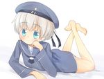 aiba_kou barefoot blue_eyes blush chin_rest clothes_writing crossed_legs dress hat kantai_collection looking_at_viewer lying on_stomach sailor_dress sailor_hat short_hair silver_hair solo z1_leberecht_maass_(kantai_collection) 