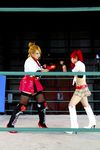  arena blonde_hair boxing_ring breasts candy_cane_(rumble_roses) candy_cane_(rumble_roses)_(cosplay) chouzuki_maryou cleavage cosplay fingerless_gloves gloves large_breasts miss_spencer miss_spencer_(cosplay) multiple_girls photo red_hair rumble_roses rumble_roses_xx suzuka_itsuki 