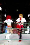  arena blonde_hair boxing_ring breasts candy_cane_(rumble_roses) candy_cane_(rumble_roses)_(cosplay) chouzuki_maryou cleavage cosplay fingerless_gloves glasses gloves large_breasts miss_spencer miss_spencer_(cosplay) multiple_girls photo red_hair rumble_roses rumble_roses_xx suzuka_itsuki 