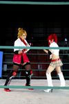  arena blonde_hair boxing_ring breasts candy_cane_(rumble_roses) candy_cane_(rumble_roses)_(cosplay) chouzuki_maryou cleavage cosplay fingerless_gloves gloves large_breasts miss_spencer miss_spencer_(cosplay) multiple_girls photo red_hair rumble_roses rumble_roses_xx suzuka_itsuki 