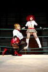  arena blonde_hair boxing_ring breasts candy_cane_(rumble_roses) candy_cane_(rumble_roses)_(cosplay) chouzuki_maryou cleavage cosplay fingerless_gloves gloves large_breasts miss_spencer miss_spencer_(cosplay) multiple_girls photo red_hair rumble_roses rumble_roses_xx suzuka_itsuki 