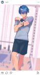  1boy black_shorts blurry closed_mouth depth_of_field ensemble_stars! grey_shirt gym hair_between_eyes hand_on_own_shoulder highres holding holding_phone instagram_logo legs light_blush looking_at_phone looking_down male_focus phone sazanami_jun selfie shirt short_hair short_sleeves shorts shy solo toroi_(run01211) 