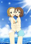  bikini breast_press breasts brown_eyes brown_hair cloud day forehead hairband hamao hirasawa_yui holding_hands interlocked_fingers k-on! light_rays looking_at_viewer mirror_twins multiple_girls ocean open_mouth outdoors short_hair sky small_breasts smile sunbeam sunlight swimsuit symmetrical_docking tainaka_ritsu waves 