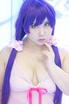  1girl asian breasts cleavage cosplay finger_to_mouth green_eyes large_breasts love_live!_school_idol_project photo plump purple_hair ribbon sakusan solo toujou_nozomi toujou_nozomi_(cosplay) twintails 