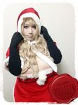  1girl blonde_hair breasts brown_eyes christmas fat gloves hoshima_mika huge_breasts photo santa_costume 