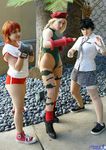  3girls boxing_gloves braid cammy_white cammy_white_(cosplay) capcom cosplay gauntlets gloves ikuy kasugano_sakura kasugano_sakura_(cosplay) leotard makoto makoto_(cosplay) makoto_(street_fighter) makoto_(street_fighter)_(cosplay) multiple_girls necktie open_mouth photo red_hair school_uniform short_hair skirt smile solo sportswear street_fighter thong_leotard tie twin_braids v 