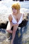  1girl asian beach blonde_hair breasts chouzuki_maryou cosplay highres large_breasts miss_spencer miss_spencer_(cosplay) ocean photo plump rumble_roses rumble_roses_xx 