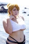  1girl asian beach blonde_hair breasts chouzuki_maryou cosplay highres large_breasts miss_spencer miss_spencer_(cosplay) ocean photo plump rumble_roses rumble_roses_xx 