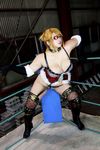  1girl arena blonde_hair boxing_ring breasts chouzuki_maryou cleavage cosplay eyepatch fingerless_gloves gloves large_breasts mistress_spencer mistress_spencer_(cosplay) photo rumble_roses rumble_roses_xx solo 