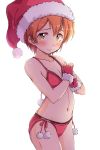  1girl bikini blush christmas clenched_hands collarbone embarrassed fingerless_gloves flat_chest fur-trimmed_gloves fur_trim gloves hat highres hoshizora_rin looking_at_viewer love_live! love_live!_school_idol_project navel orange_hair pom_pom_(clothes) red_bikini red_gloves santa_bikini santa_hat sen_(sen0910) short_hair simple_background solo stomach swimsuit white_background yellow_eyes 