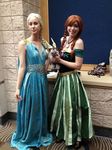  2girls a_song_of_ice_and_fire anna_(frozen) blue_dress braid braids carrie carrie_marie cosplay daenerys_targaryen disney dress frozen_(disney) game_of_thrones green_dress jewelry multiple_girls necklace photo smile standing story stuffed_toy urulokid 