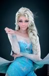  1girl 3d asymmetrical_hair blue_dress blue_eyes braid dark_background disney dress elsa_(frozen) frozen_(disney) highres jewelry jiyu-kaze jiyu_kaze looking_at_viewer queen raised_eyebrow realistic see-through sequins silver_hair solo 