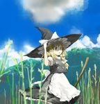  blonde_hair broom cloud day hand_on_headwear hat kirisame_marisa poncho_(poncho) sky solo touhou witch_hat 