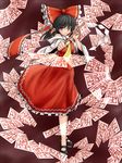  araki_(qbthgry) black_eyes black_hair bow danmaku foreshortening gohei hair_bow hakurei_reimu mary_janes ofuda ribbon shoes solo standing touhou 