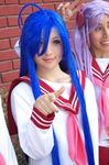  ahoge blue_eyes blue_hair cosplay hiiragi_kagami izumi_konata long_hair lucky_star mole mole_under_eye multiple_girls photo pink_neckwear pointing pointing_at_viewer purple_hair reference_photo reference_work ribbon ryouou_school_uniform school_uniform serafuku smile 