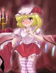  blonde_hair blush candle flandre_scarlet flx hat one_eye_closed one_side_up ponytail red_eyes solo striped striped_legwear thighhighs touhou undressing wings 