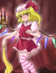  blonde_hair blush candle flandre_scarlet flx hat one_side_up ponytail red_eyes solo striped striped_legwear thighhighs touhou wings 