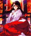  ass black_hair hakama highres houzuki_yuuno japanese_clothes kimono kure-nai leaf long_hair lying miko on_side red_eyes red_hakama scan smile solo yamamoto_yamato 