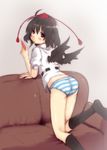  ass back black_hair black_legwear black_wings blue_panties blush couch dress_shirt from_behind hat highres kneehighs kneeling looking_at_viewer looking_back majima_yuki mouth_hold no_pants panties pencil red_eyes shameimaru_aya shirt short_hair simple_background solo striped striped_panties tokin_hat touhou underwear wings 