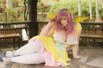  2015 big_breasts breasts chubby cleavage clothed clothing cosplay dress female fluttershy_(mlp) friendship_is_magic hair headband human legwear long_hair looking_at_viewer mammal my_little_pony outside pink_hair real shoes sitting solo stockings underbust_(artist) wings 