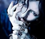  1boy black_hair blue_eyes bracelet earrings gackt j-rock jewelry looking_at_viewer male male_focus musician photorealistic realistic ring solo 