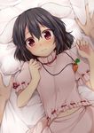  animal_ears black_hair blush bunny_ears carrot_necklace inaba_tewi jewelry looking_at_viewer lying navel nnyara on_back pendant pillow push_down red_eyes ribbon-trimmed_clothes ribbon-trimmed_sleeves ribbon_trim short_hair short_sleeves solo_focus touhou 