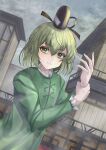  1girl black_headwear closed_mouth dress expressionless fog green_dress green_eyes green_hair highres long_sleeves looking_to_the_side overcast short_hair sky soga_no_tojiko solo tofuandsoup touhou 