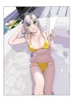  1girl antenna_hair bathtub bikini book breasts feet_out_of_frame green_eyes grey_hair highres kantai_collection kinugasa_(kancolle) looking_at_viewer medium_breasts medium_hair ojipon partially_submerged sitting solo swimsuit water yellow_bikini 