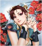  absurdres alternate_costume border bracer brown_hair bun_cover china_dress chinese_clothes chun-li cleavage_cutout commentary_request double_bun dress earrings eyelashes eyeshadow floral_background flower gtolin_chang highres jewelry lips lipstick makeup nose ring short_hair solo street_fighter wedding_ring 