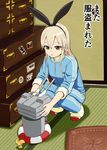  alternate_costume animal_ears blonde_hair brown_eyes bunny_ears chest_of_drawers cushion drawer fake_animal_ears hairband indoors kantai_collection lifebuoy long_hair long_sleeves pillow propeller rensouhou-chan shimakaze_(kantai_collection) shoes sidelocks sleeves_pushed_up solo squatting sticker sukeroku_(treeee) tatami track_suit translated uwabaki 