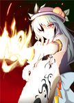  beegle fire food fruit hair_over_one_eye hat highres hinanawi_tenshi long_hair peach red_eyes slit_pupils solo sword sword_of_hisou touhou weapon 